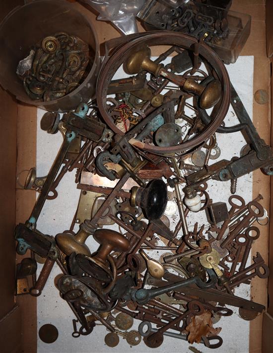 Three boxes of furniture handles, castors, keys and accessories